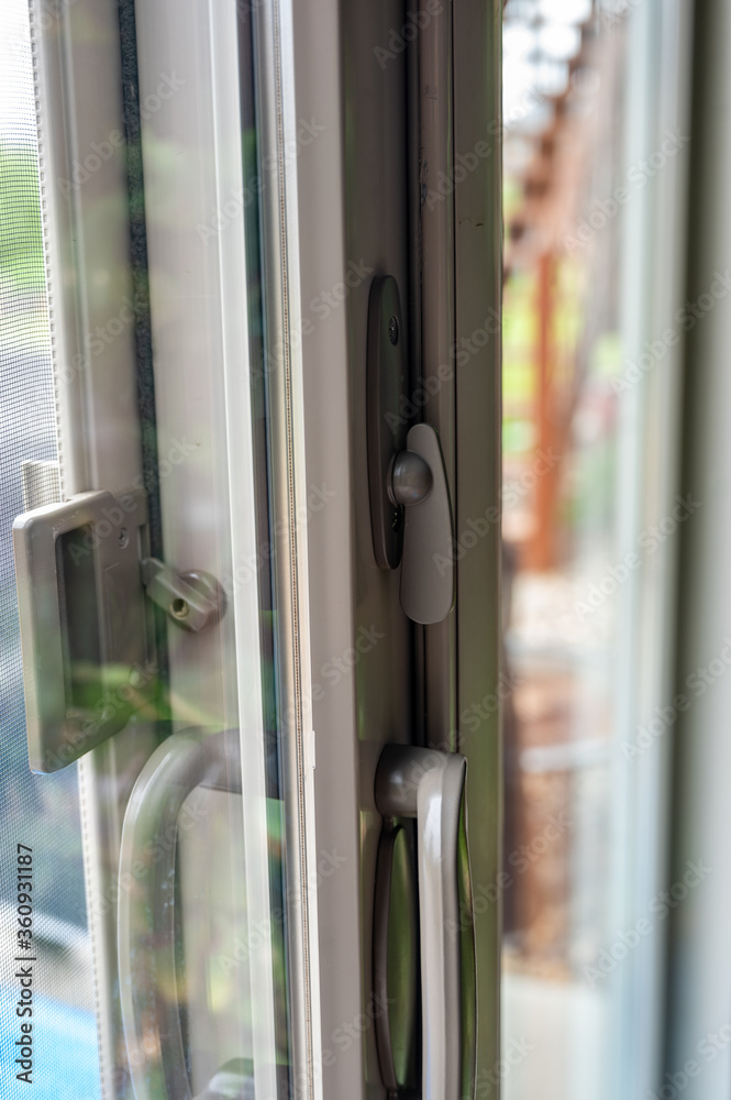 Handle, locking hardware, and jam to a sliding glass and screen door. Handle, locking hardware, and jam to a sliding glass and screen door.