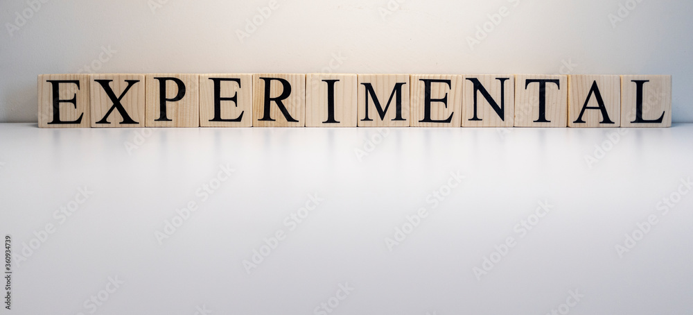Experimental text from wooden cubes. Close up. Experimental text from wooden cubes. Close up.