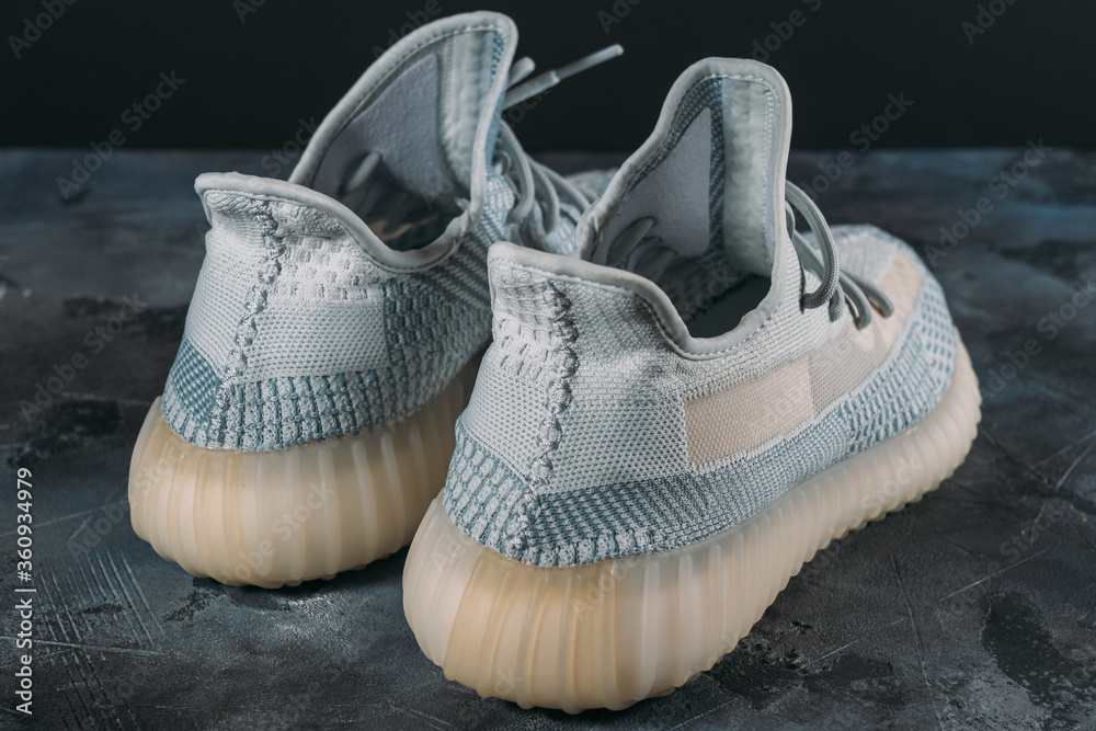 Moscow, Russia - June 2020 : Adidas Yeezy Boost 350 V2 Cloud White - Famous  Limited Collection Fashion Sneakers by Kanye West and Adidas Collaboration,  Trendy Sport Shoes foto de Stock | Adobe Stock