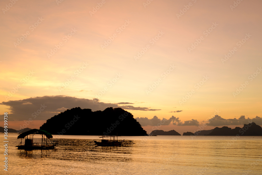 silouhette of boat at sunset