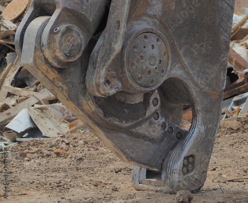 Close up metal shear in scrap yard