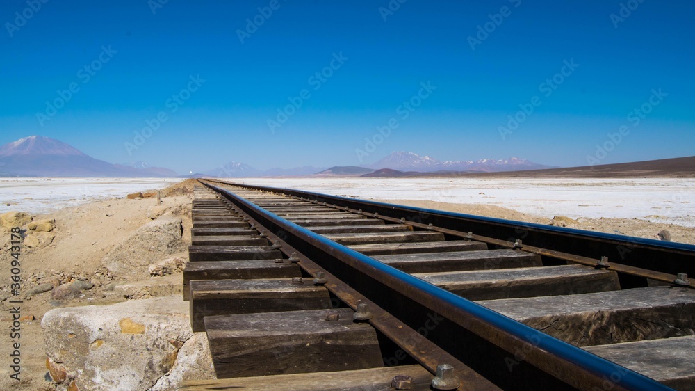 Train tracks in the Bolivian desert. Railway in the middle of the desert