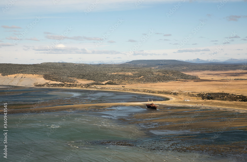 Seascape. Aerial view of the bay, beach, turquoise pure ocean water, coastline, sand and stranded ship on shore. Seascape. Aerial view of the bay, beach, turquoise pure ocean water, coastline, sand and stranded ship on shore.