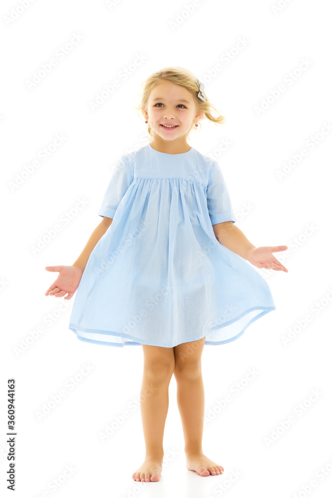 Little girl in an elegant dress.The concept of a happy childhood, healthy lifestyle. Little girl in an elegant dress.The concept of a happy childhood, healthy lifestyle.