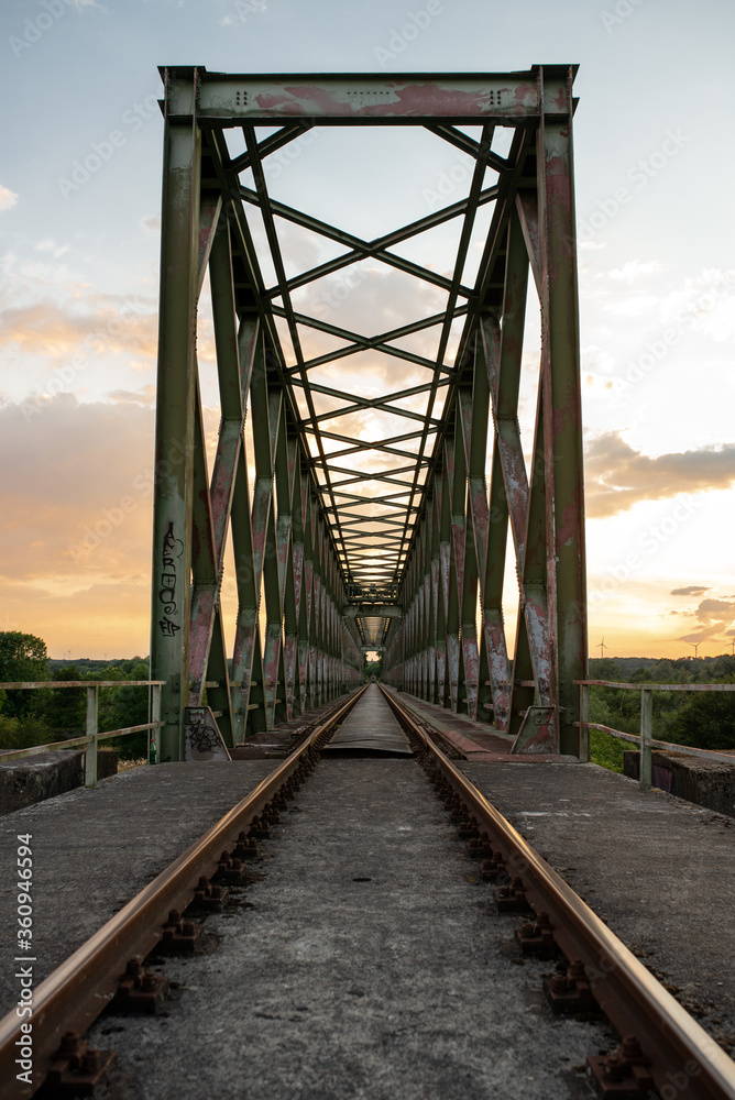 abandoned railway bridge during sunset
abandoned railway bridge during sunset