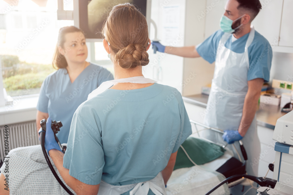 doctors in internal department of hospital performing endoscopy