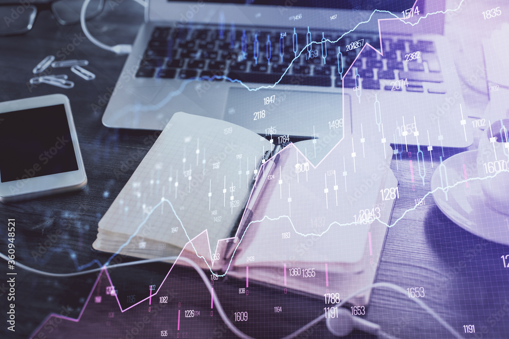 Multi exposure of financial graph drawings and desk with open notebook background. Concept of forex Multi exposure of financial graph drawings and desk with open notebook background. Concept of forex
