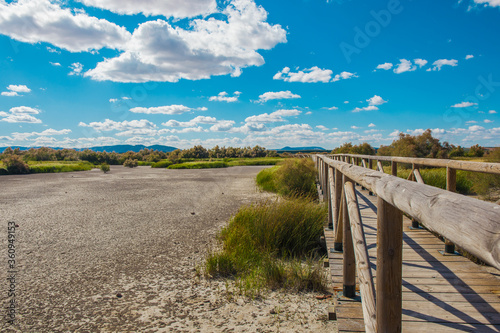 Bridge. Wooden bridge on the lagoon “Fuente De Piedra”. 