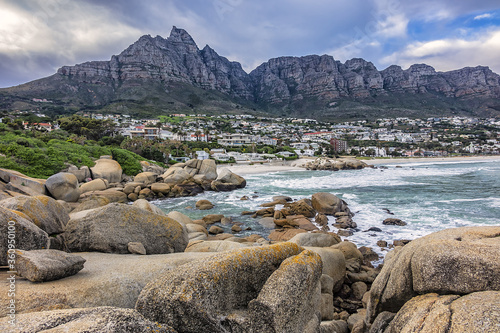 Wonderful Camps Bay nature (Kampsbaai) before sunset - affluent suburb of Cape Town. Camps Bay bordered by spectacular Twelve Apostles Mountain and glittering Atlantic Ocean. Camps Bay, South Africa.