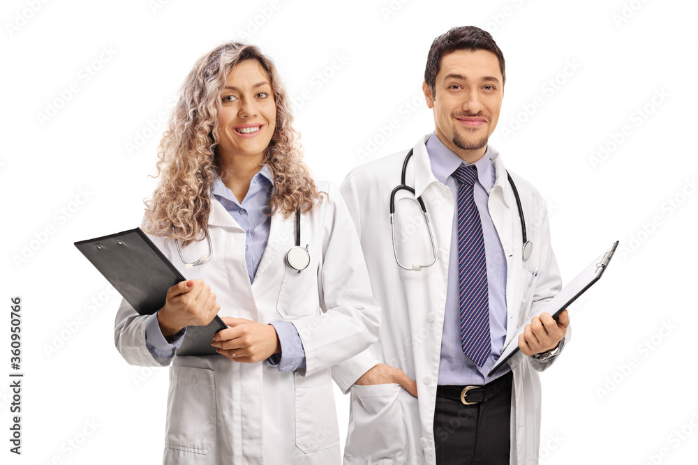 Young female and male doctors holding clipboards