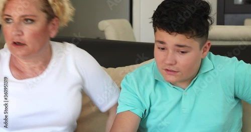 Angry mother and her teenage son yelling at each other