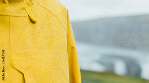 Bright yellow, goretex rain covered jacket on a trip to rainy Iceland photo