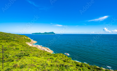 China Guangdong Shenzhen Dapeng Peninsula Dongchong coastline summer blue sky and white clouds scenery
