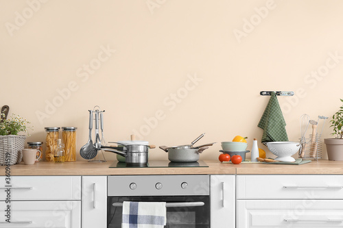 Set of utensils on kitchen counter © Pixel-Shot