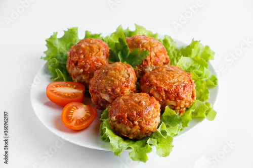 Meat balls in tomato sauce isolated on a white background.