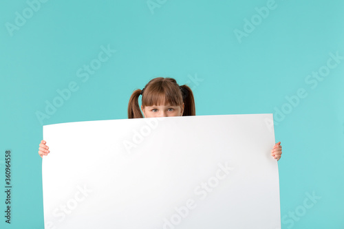 Little girl with blank post...