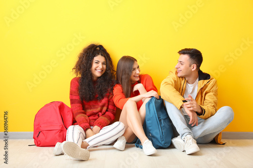 Young students sitting near...