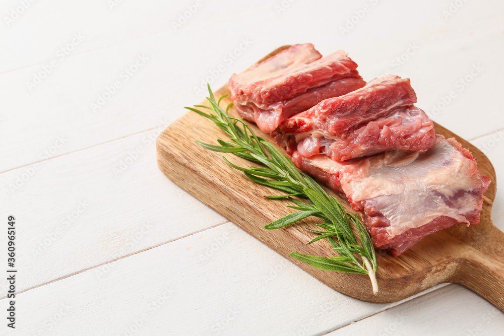 Raw beef short ribs with herbs on table Raw beef short ribs with herbs on table