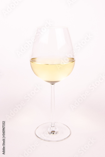 Glass of white wine on white background isolated