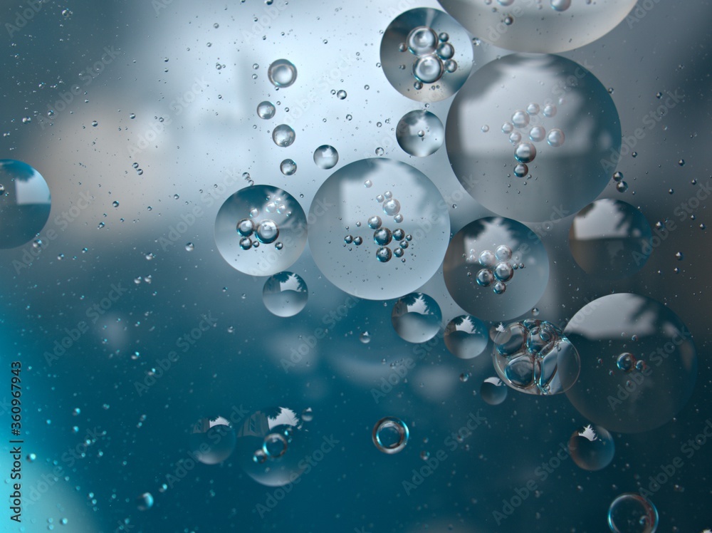 Closeup blue bubbles of oil with soft focus and blurred background , macro image ,water droplets ,sweet color, abstract background with light blue bubbles Closeup blue bubbles of oil with soft focus and blurred background , macro image ,water droplets ,sweet color, abstract background with light blue bubbles