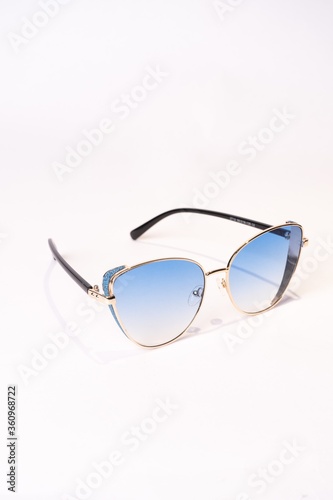 Vertical shot of clubmaster sunglasses isolated on white background photo