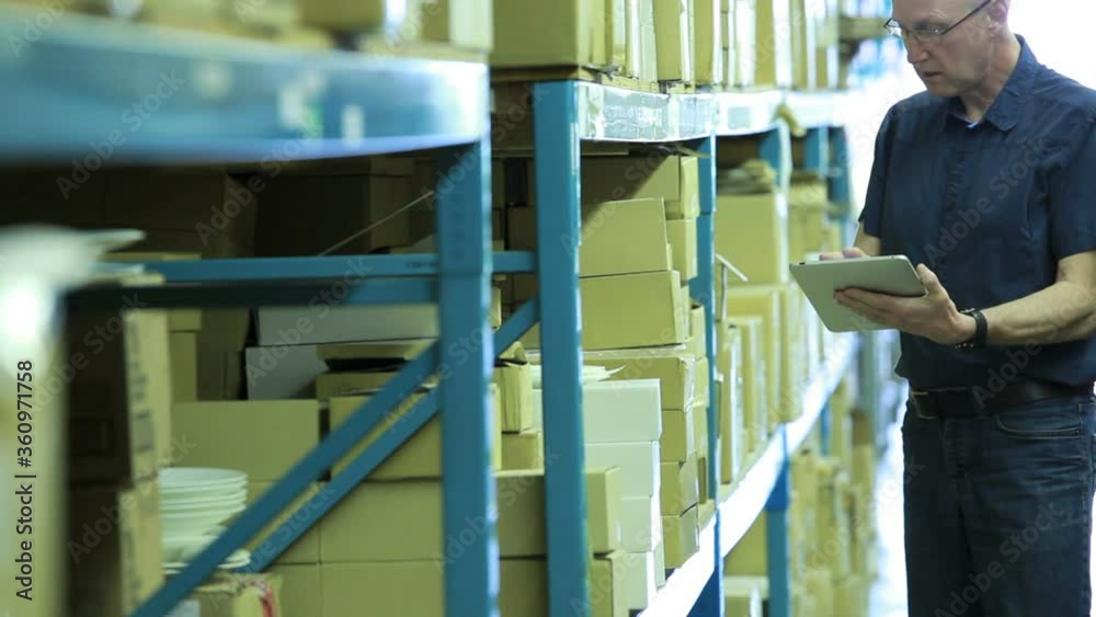Warehouseman taking stock Warehouseman taking stock