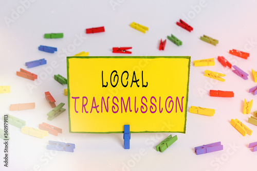 Writing note showing Local Transmission. Business concept for clusteredacquired infection cases sourced from a certain location Colored clothespin papers empty reminder white floor background office photo