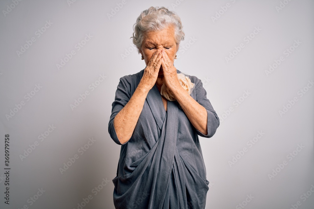 Φωτογραφία Senior beautiful grey-haired woman wearing casual dress standing over white background rubbing eyes for fatigue and headache, sleepy and tired expression