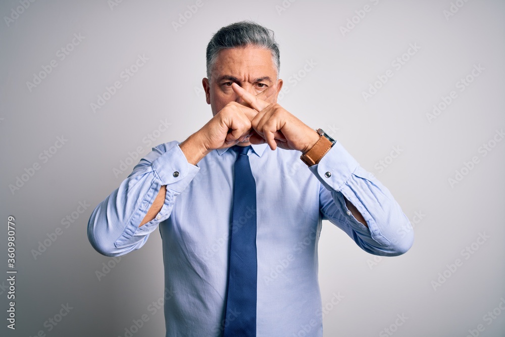Middle age handsome grey-haired business man wearing elegant shirt and tie Rejection expression crossing fingers doing negative sign Middle age handsome grey-haired business man wearing elegant shirt and tie Rejection expression crossing fingers doing negative sign