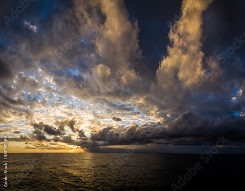 sunset over the Atlantic ocean clouds © Janelle