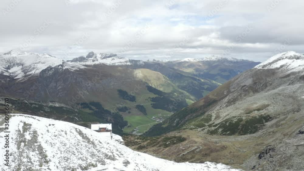 Viewing ranges of snow mountains and green valleys from Hintertux Glacier, Tyrol Viewing ranges of snow mountains and green valleys from Hintertux Glacier, Tyrol