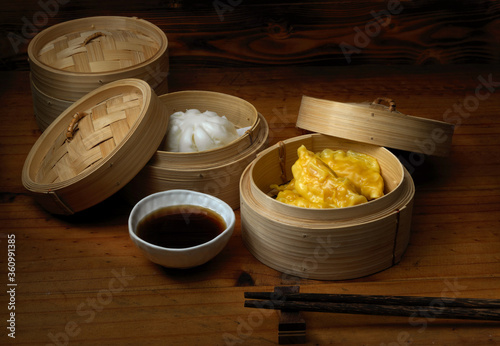 Close up view of steamed dumplings serving on bamboo seamer