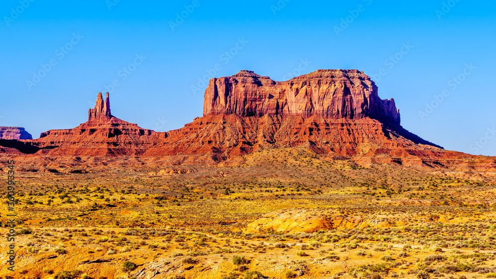 The towering sandstone Buttes and Mesas of Big Indian Butte and Sentinel Mesa in the Navajo Nation's Monument Valley Navajo Tribal Park on the border of Arizona and Utah, United States