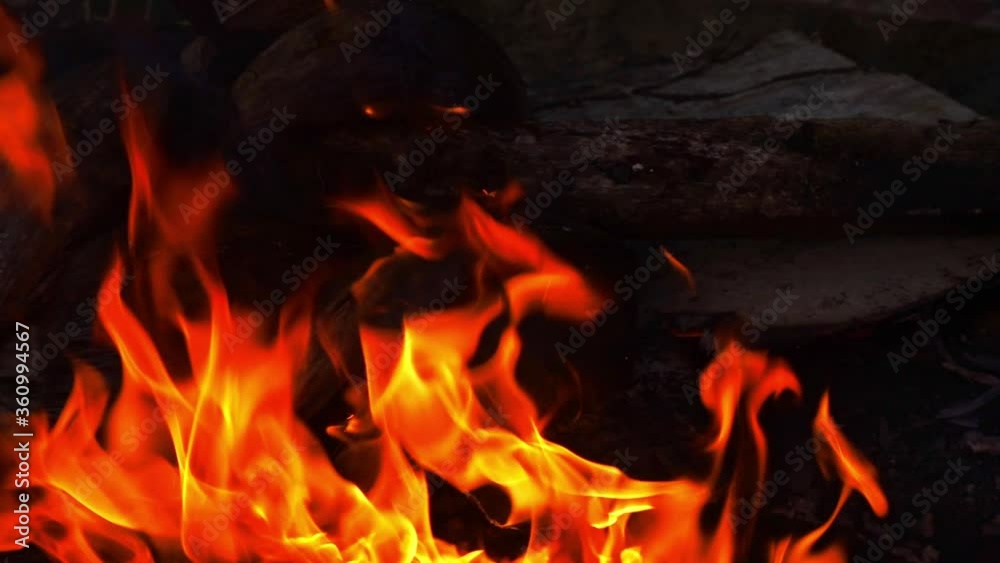 Open log fire burning in slow motion at night time Open log fire burning in slow motion at night time