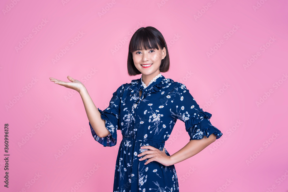 Asian attractive cute short hair woman happy smiling pointing finger hand advertisement presenting confident independent mother businesswoman wearing dress pink isolated background studio portrait Asian attractive cute short hair woman happy smiling pointing finger hand advertisement presenting confident independent mother businesswoman wearing dress pink isolated background studio portrait