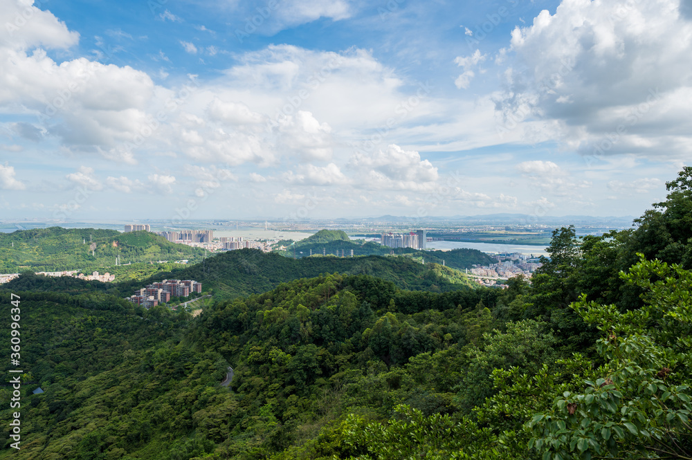 Fototapeta premium Mountain climbing overlooking the city