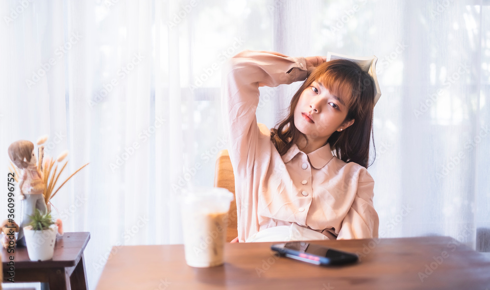 Beautiful Asian girl relaxing studying reading book casual free time weekend at café drinking coffee, social distancing feeling sad loneliness bored upset tired sleepy anxious, sitting chill careless Beautiful Asian girl relaxing studying reading book casual free time weekend at café drinking coffee, social distancing feeling sad loneliness bored upset tired sleepy anxious, sitting chill careless