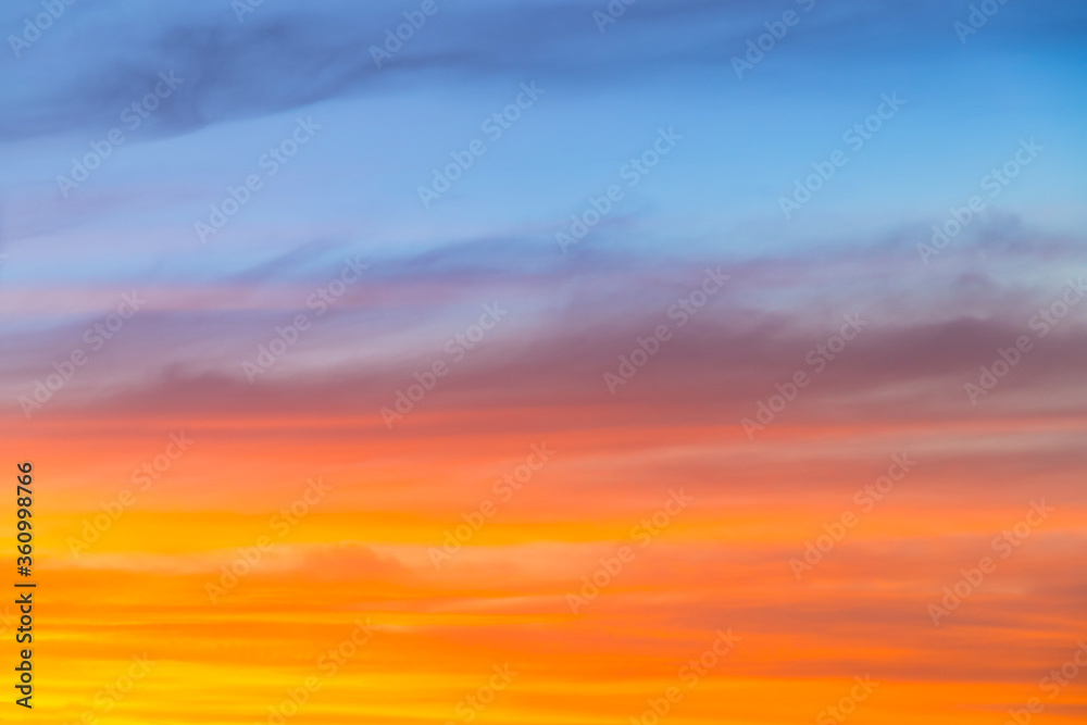 Amazing blue, orange and yellow colors sunset sky gradient background