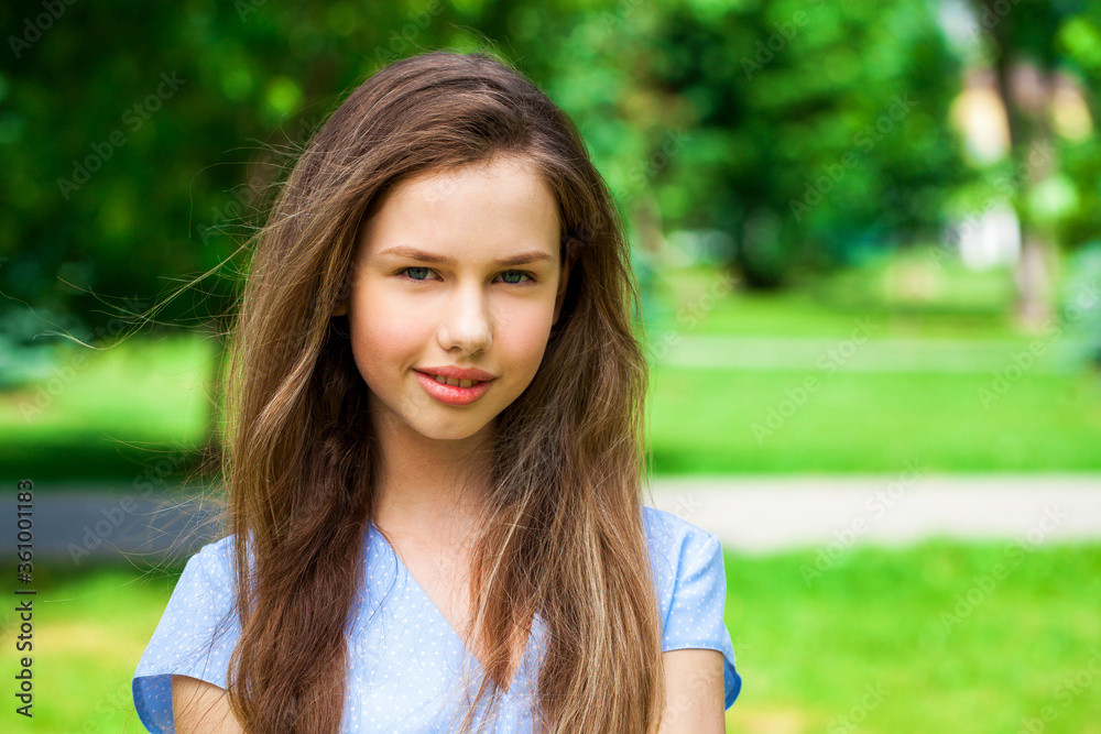 Portrait of a young beautiful teenager girl in blue dress Portrait of a young beautiful teenager girl in blue dress