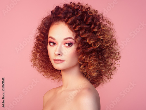 Beautiful woman face. Perfect makeup. Beauty fashion. Cosmetic. Eyeshadow. Elegant afro curly hairstyle