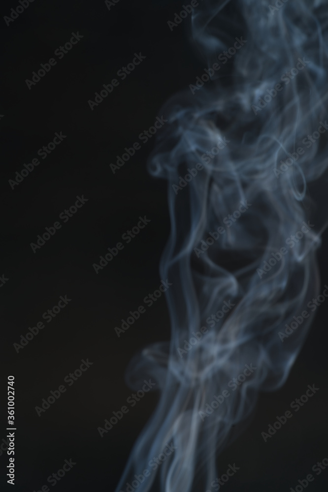 Blurred images of white smoke, black background conceptualization. Blurred images of white smoke, black background conceptualization.