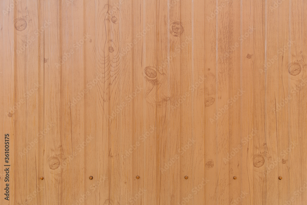 Tin fence with a beautiful textured pattern. Modern fence with vertical stripes. Tin fence with a beautiful textured pattern. Modern fence with vertical stripes.