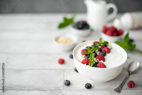 fresh greek yogurt with blueberries, raspberries and mint