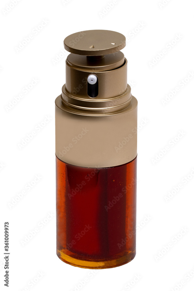 Essential oil liquid. Close-up of a brown glass spray bottle with a golden cap filled with beauty serum for face isolated on a white background. Anti aging woman. Macro.