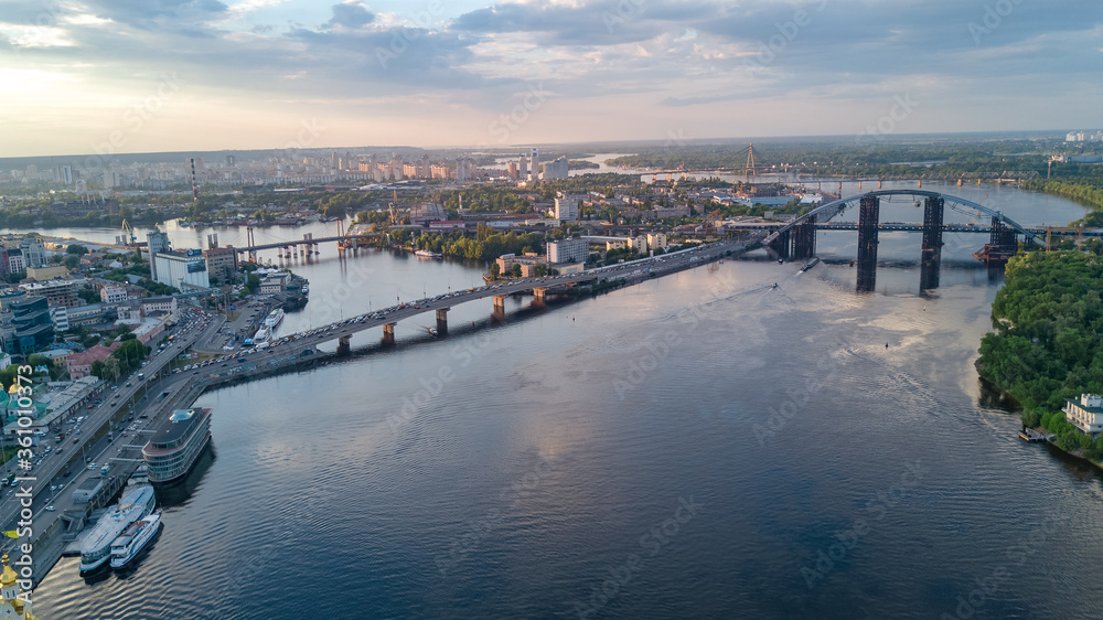 Kyiv cityscape aerial drone view, Dnipro river, downtown and Podol historical district skyline from above, city of Kiev and Dnieper, Ukraine