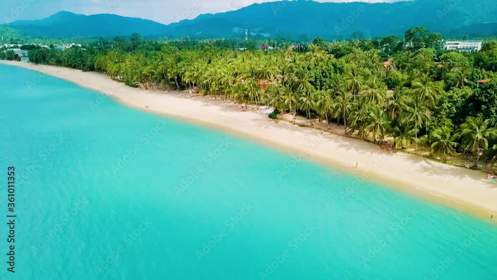 Aerial view of tropical white sand beach and turquoise clear sea water with small waves and palm trees forest from koh samui island,thailand Ban Tai Beach Koh samui Thailand Aerial view of tropical white sand beach and turquoise clear sea water with small waves and palm trees forest from koh samui island,thailand Ban Tai Beach Koh samui Thailand