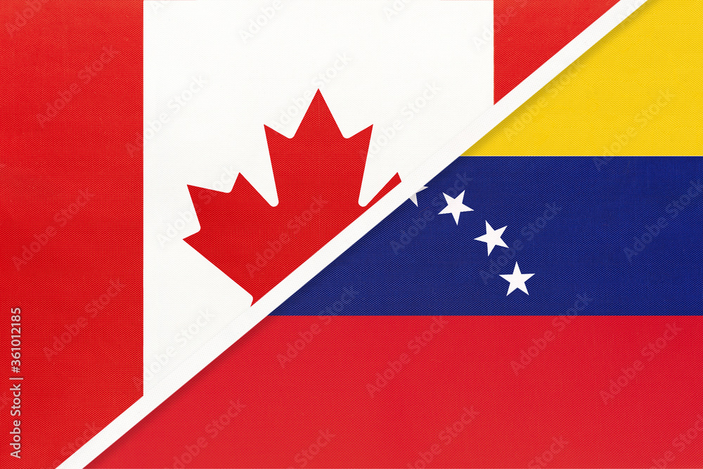 Fototapeta premium Canada and Venezuela, symbol of national flags from textile. Championship between two American countries.