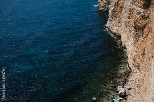 Beautiful view from the cliff on the blue sea. © YURII Seleznov