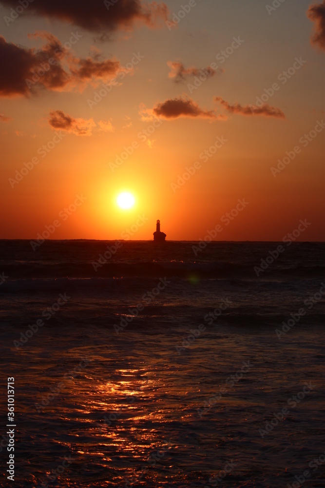 Sunrise at the lighthouse of Tourlitis at Andros, Greece 