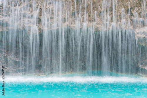 landscape of beautiful Artificial waterfall in garden at the public park © CasanoWa Stutio